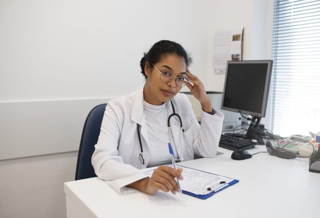 medium-shot-doctor-sitting-desk