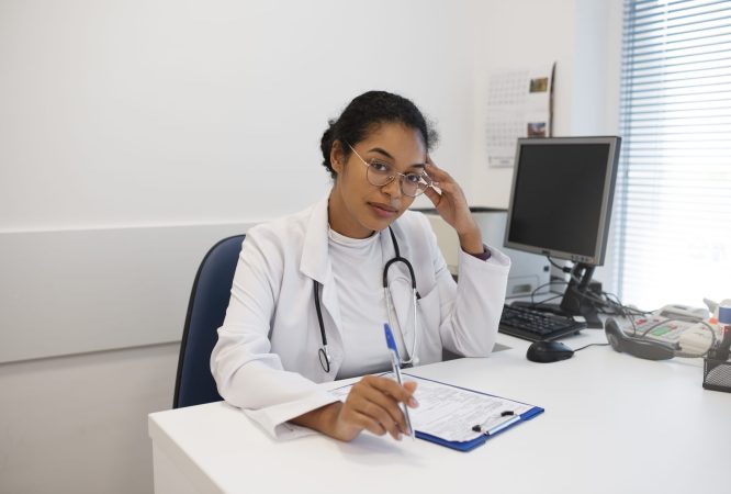 medium-shot-doctor-sitting-desk