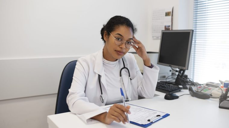 medium-shot-doctor-sitting-desk